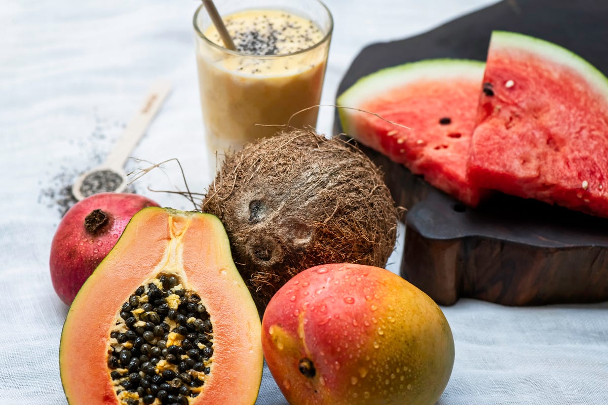Fruit board with mango, coconut, pomegranate, papaya and watermelon