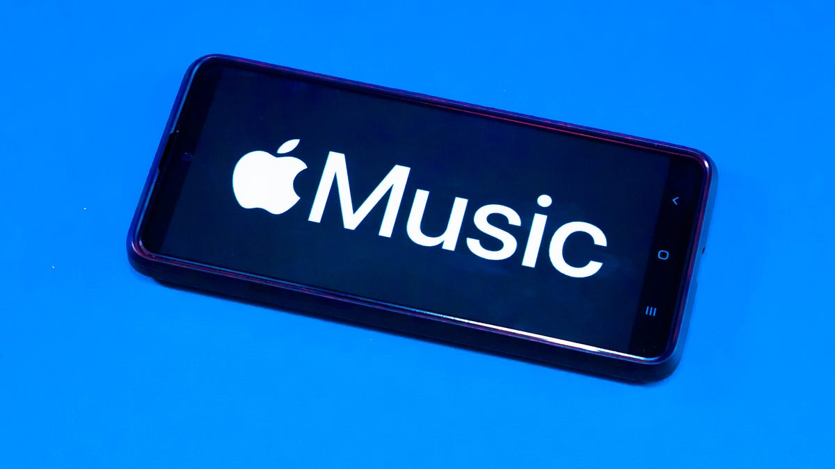 Apple music logo on an iPhone with a blue background
