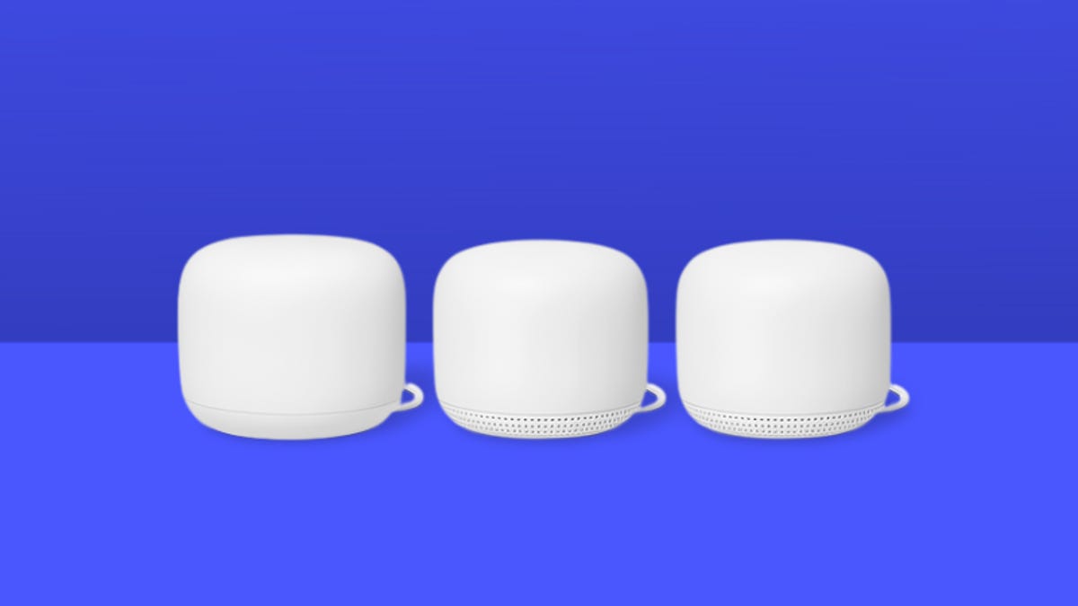 Three white Google Nest routers against a blue background.