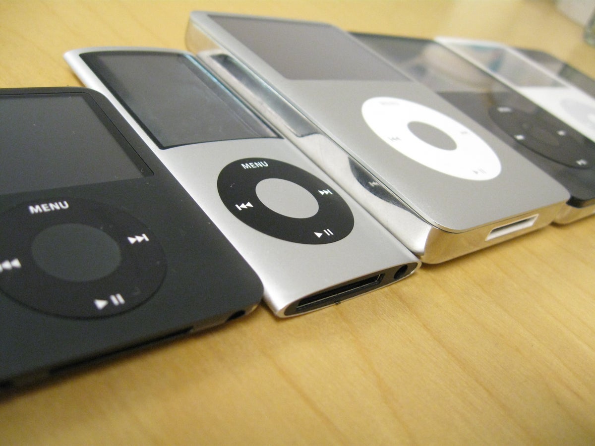 Photo of multiple iPods on desk.