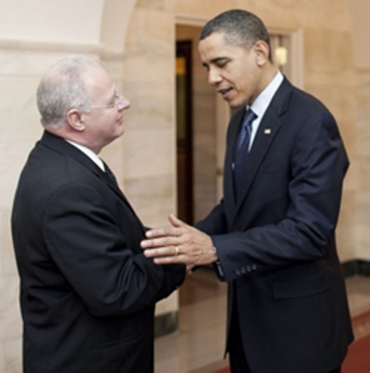 Barack Obama greets new White House cybersecurity chief Howard A. Schmidt.