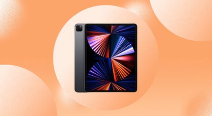 The Apple iPad Pro with an M1 chip from 2021 is displayed against an orange background.