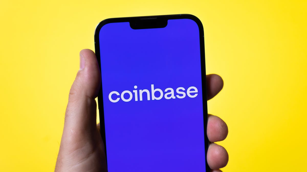 The Coinbase logo on an iPhone 13 Pro