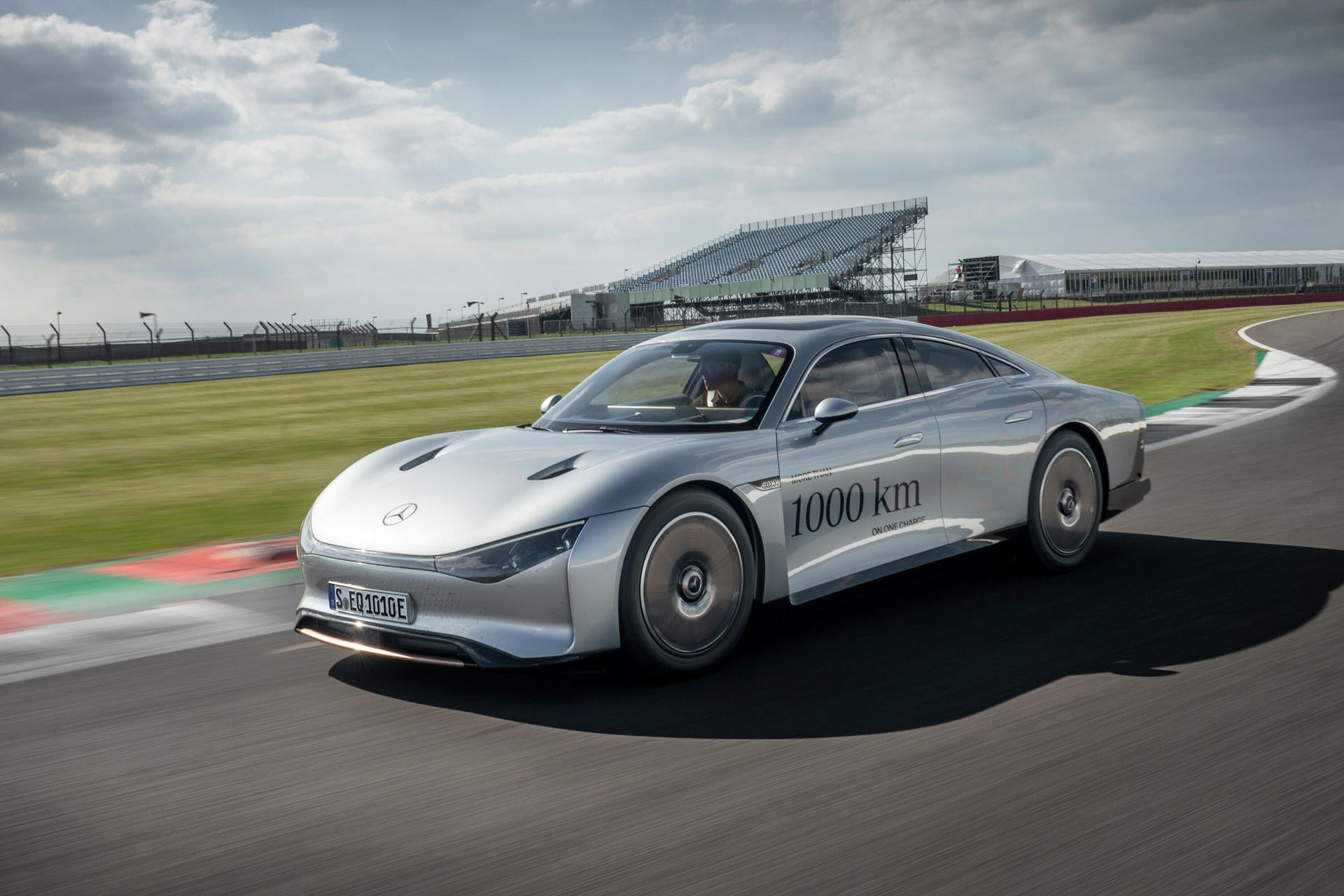 Front 3/4 view of the Mercedes-Benz Vision EQXX concept driving on the Silverstone race track