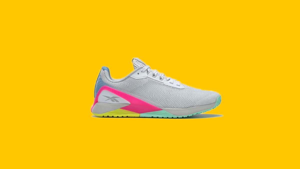 Close up of women's Reebok shoes on a yellow background