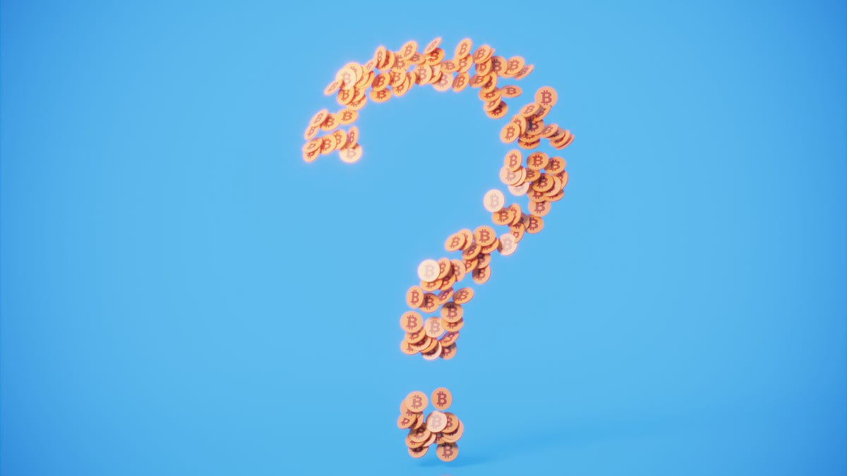 Photo illustration of coins forming a question mark