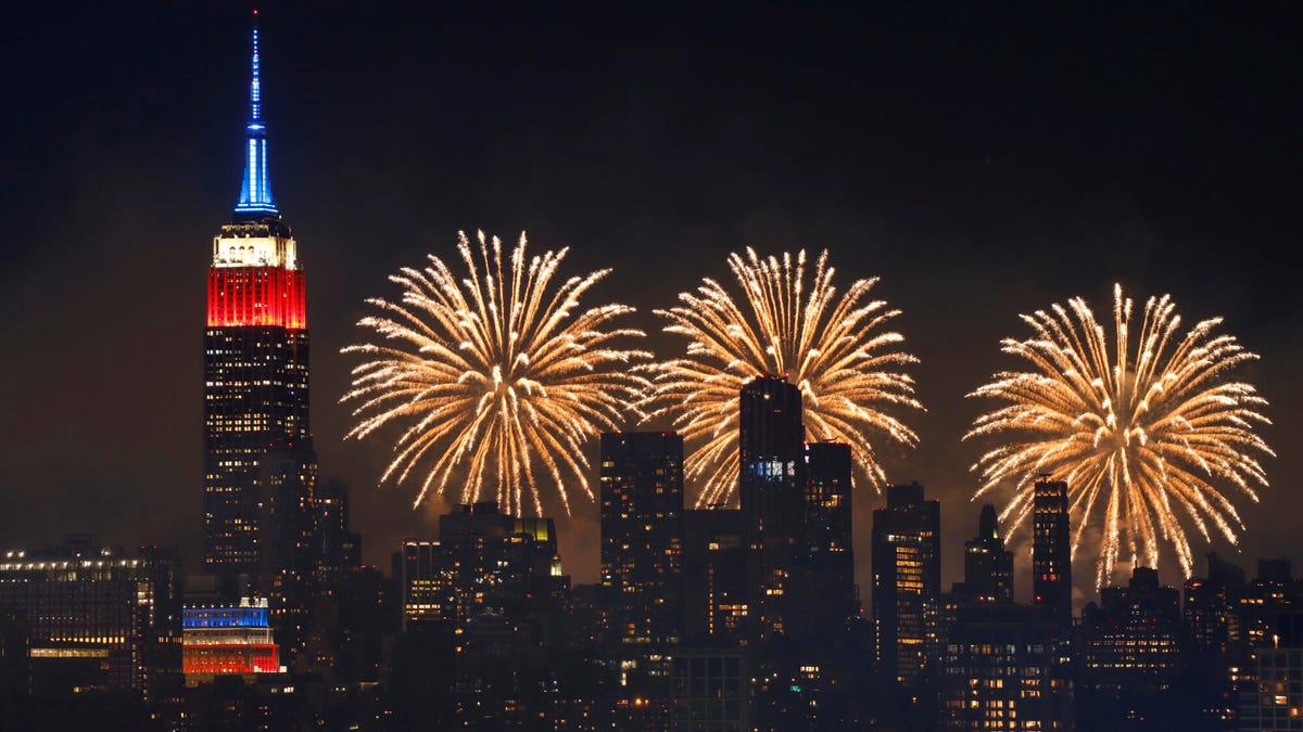 The Macy's 4th of July fireworks show lights up the sky next to the Empire State Building in New York City on July 4, 2022