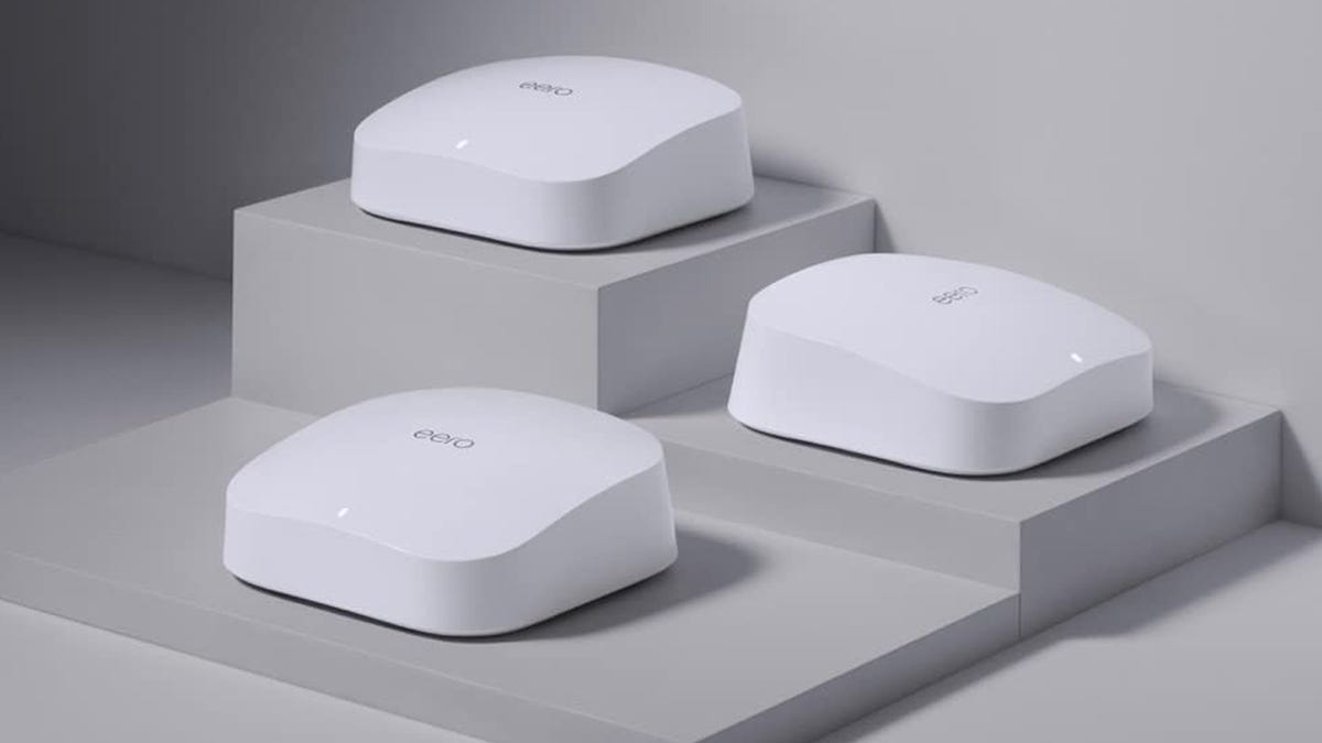 A 3-piece Eero Pro Tri-Band mesh Wi-Fi 6 system is displayed on a three-tier shelf.