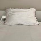 Saatva Latex Pillow on a white bed