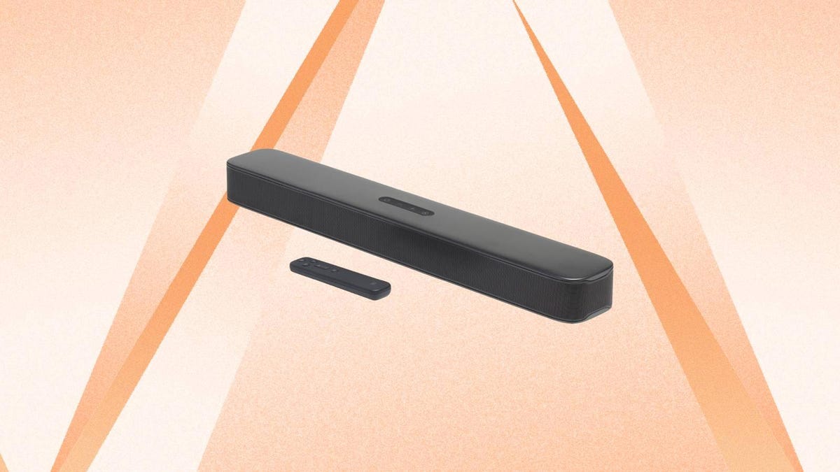 A JBL soundbar and remote against an orange background.