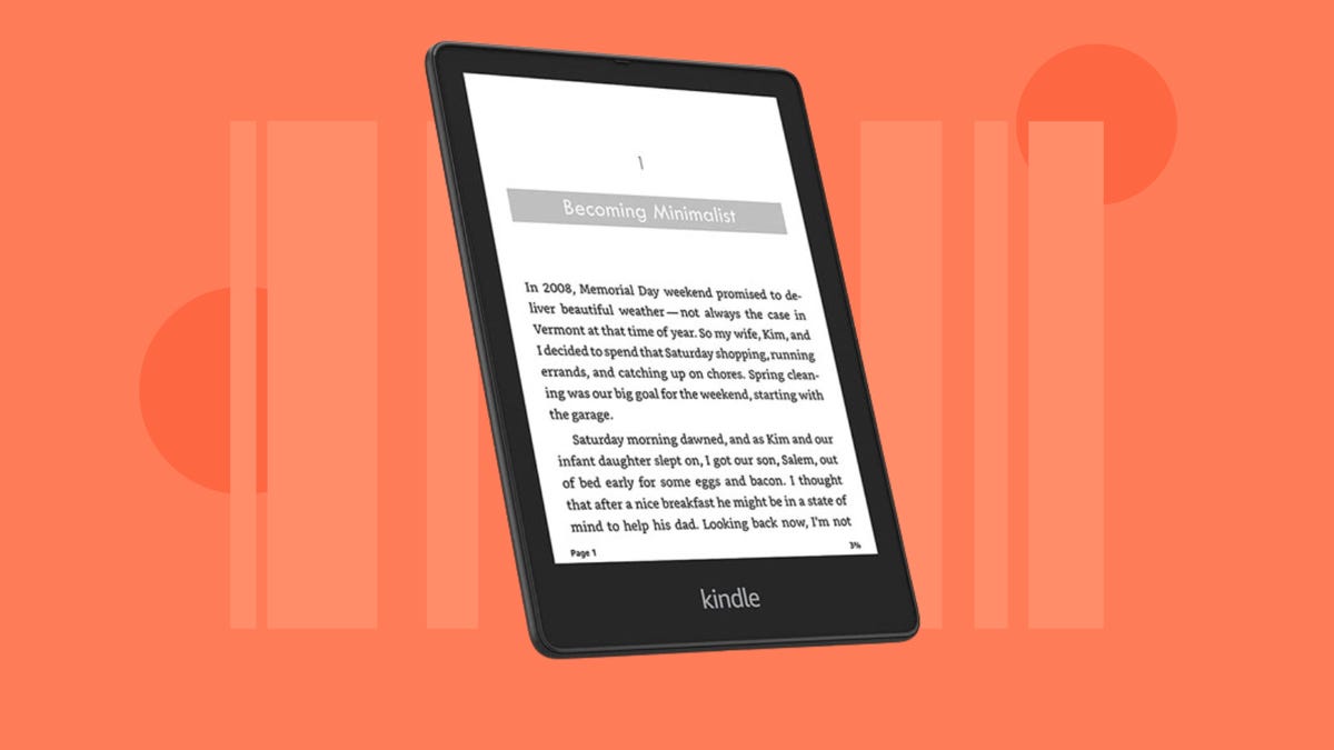 Amazon Kindle e-reader against orange background