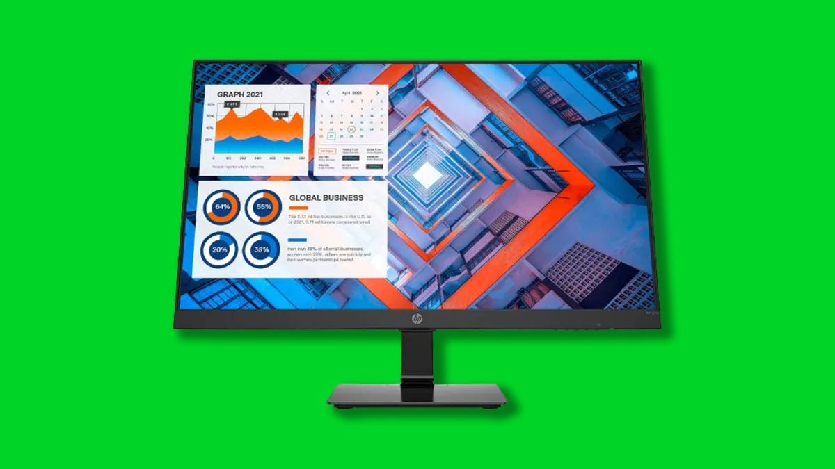 An HP monitor against a green background.