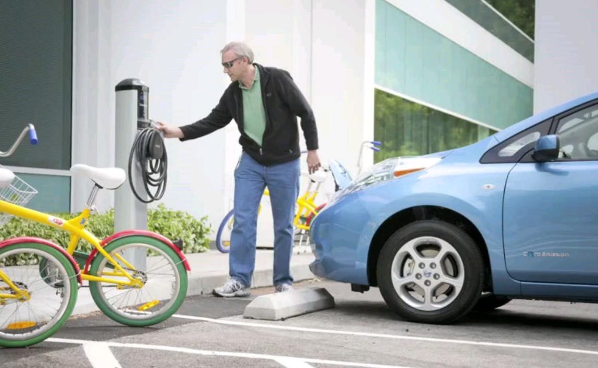 Juiced: Google's technical program manager for transportation Rolf Schreiber gets ready to charge a Nissan Leaf.