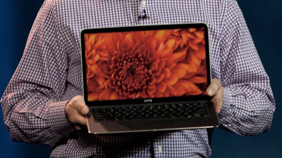 Intel's Clarke holds up the XPS 13, which is arriving later this year.