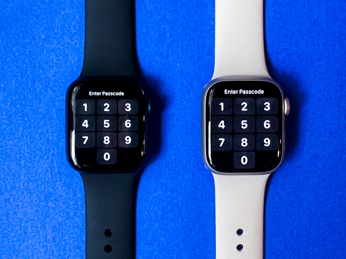 Two Apple Watch models showing passcode numbers