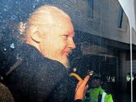 <p>Julian Assange in police vehicle after his arrest on April 11 in London.</p>