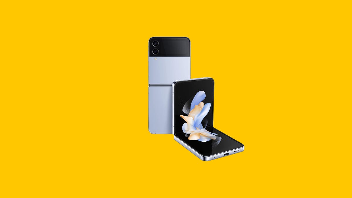 A foldable Samsung Galaxy Z Flip 4 smartphone is displayed against a yellow background.