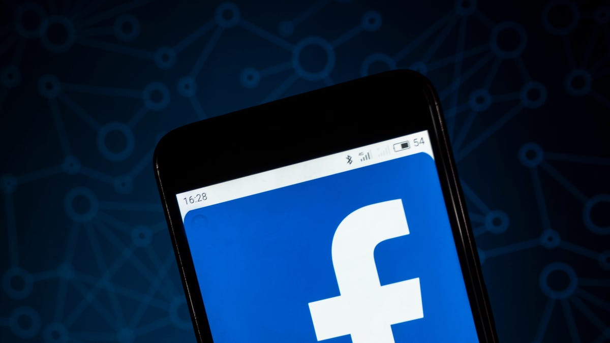 The Facebook logo seen displayed on a smart phone. According
