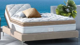 The Solaire adjustable mattress by Saatva is displayed by the water.