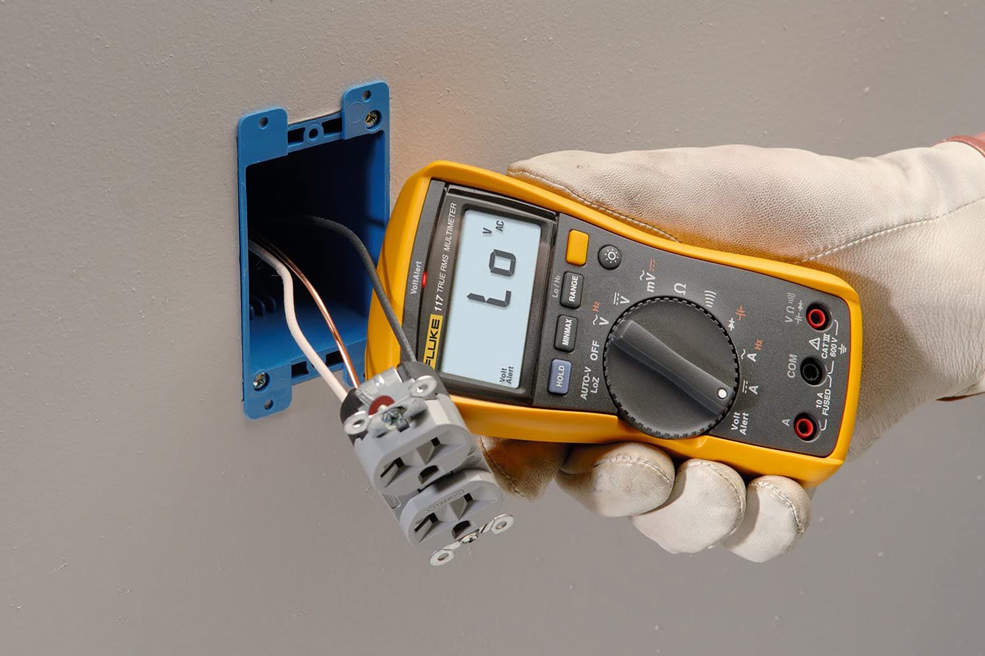 The Fluke 117 multimeter being used to take a reading