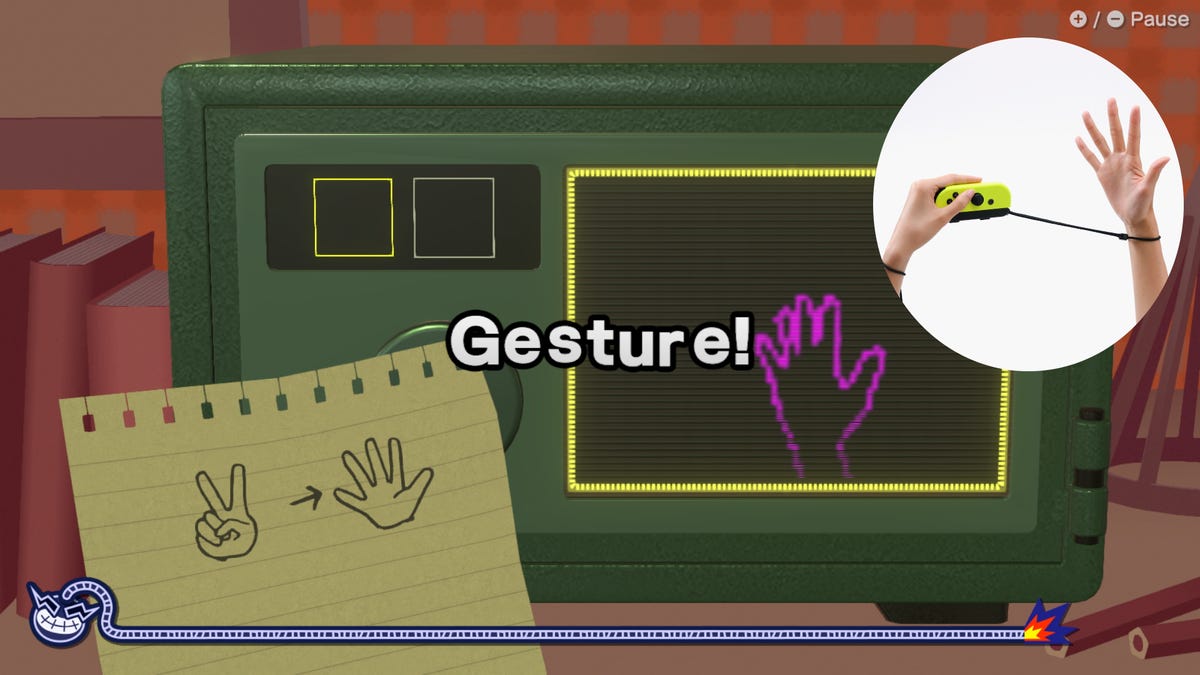 A screenshot of WarioWare Move It, showing a request to make a hand gesture and a window where a controller is pointed to a hand