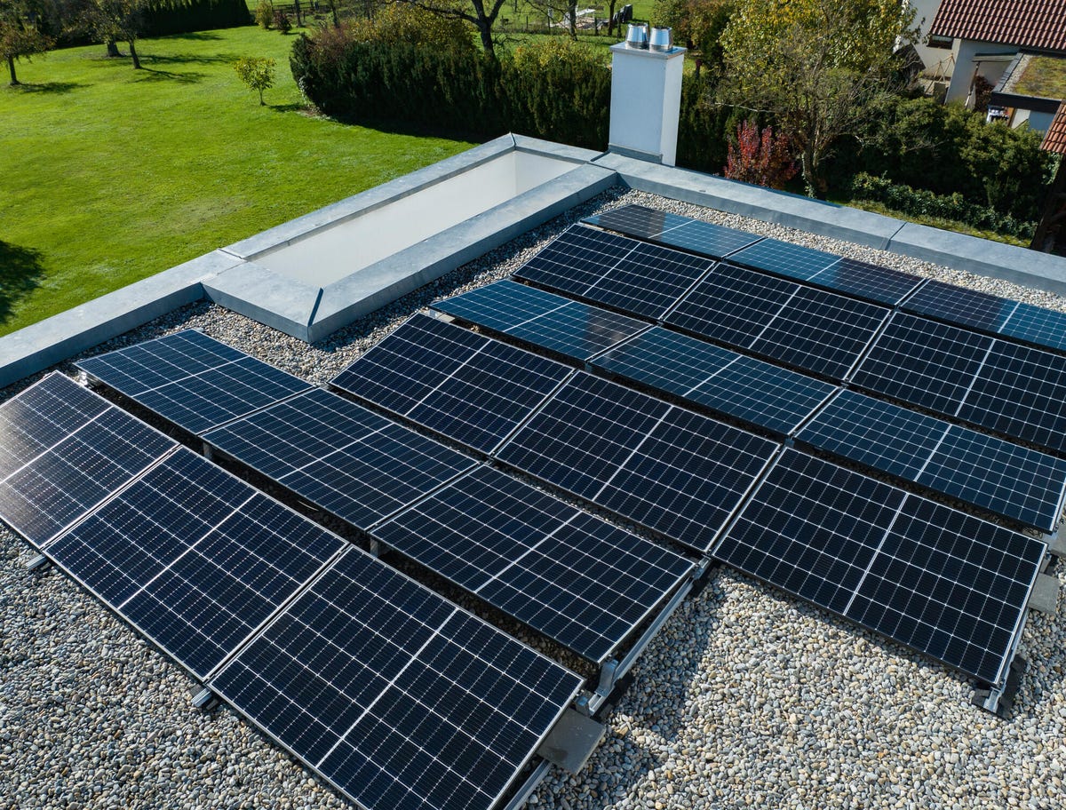 Solar panels installed on a flat roof.