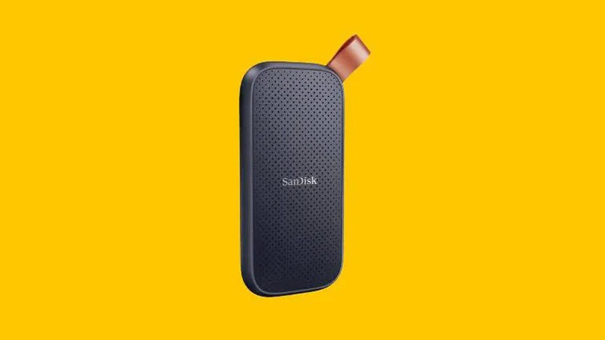 A SanDisk portable SSD external drive is displayed against a yellow background.