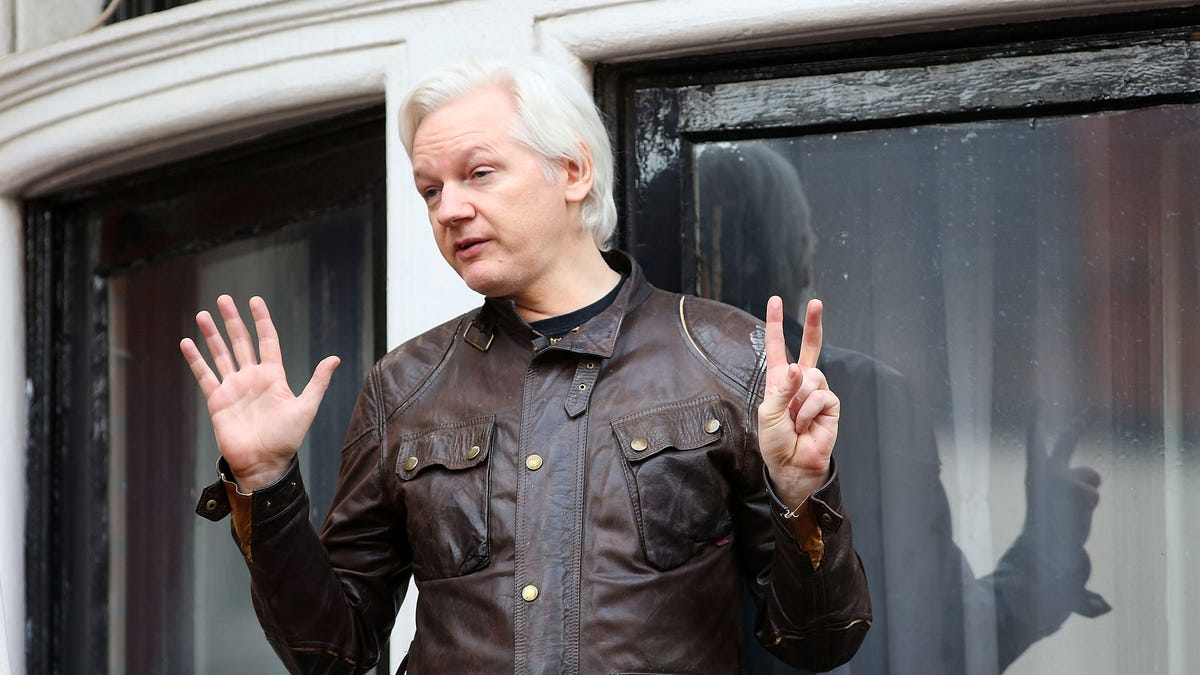 Julian Assange speaks to press from the Ecuadorian Embassy balcony in London in May 2017.
