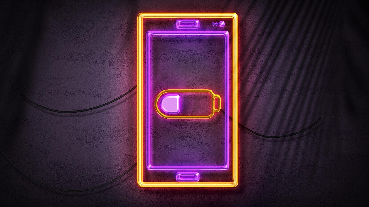 Neon sign showing phone with battery symbol in the center