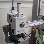 The Bambu A1 extruder showing the AMS logo