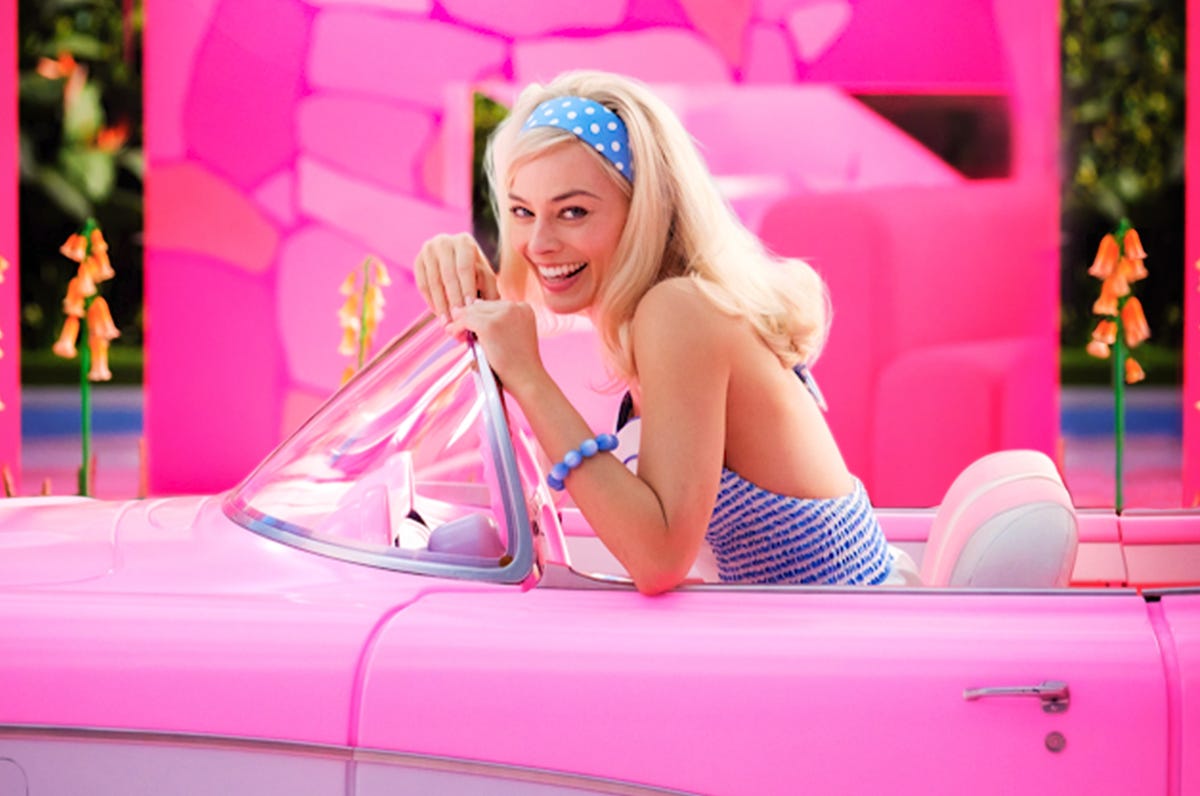 Margot Robbie as Barbie, with much pink
