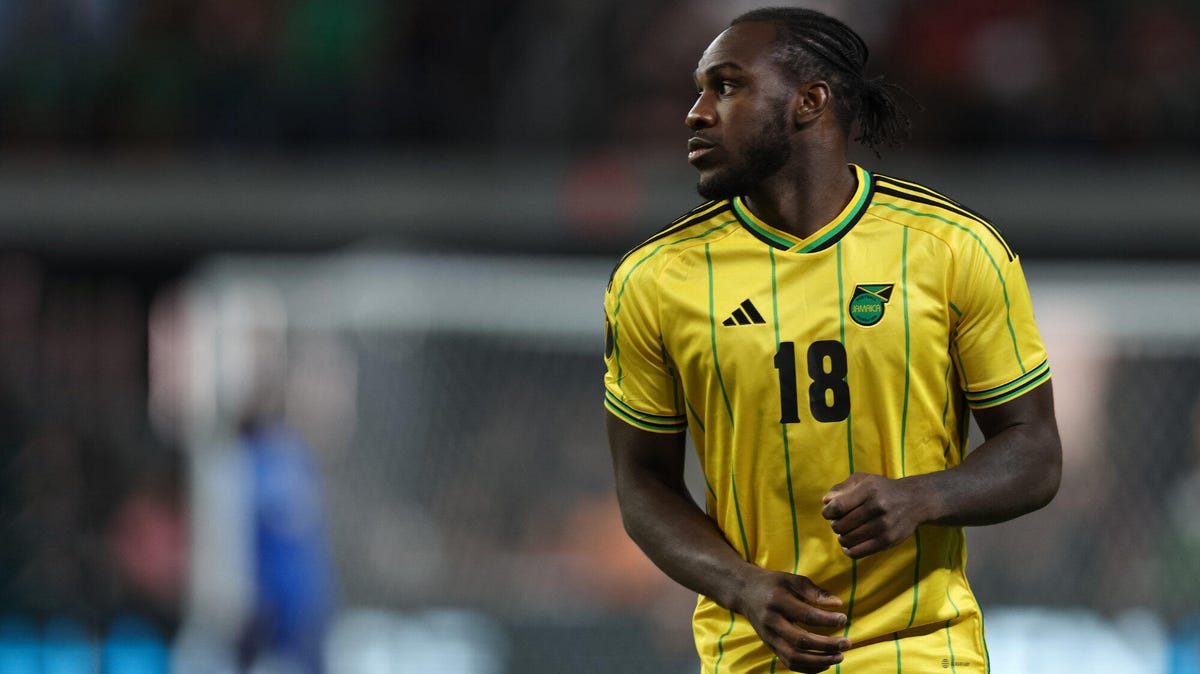 Jamaica striker  Michail Antonio looking sideways to his right.