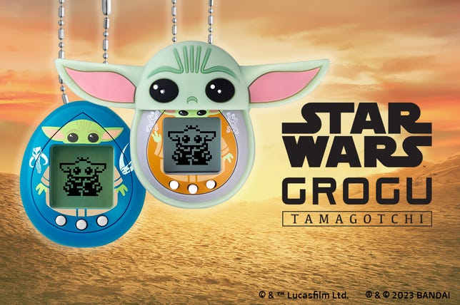 Star Wars Grogu Tamagotchi devices in front of sunset background
