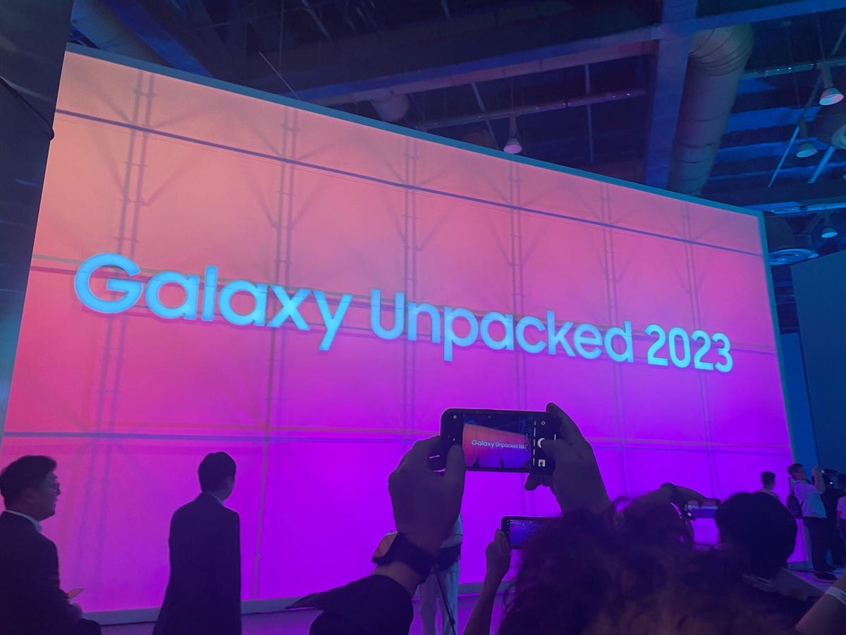 pink ombre screen that says galaxy unpacked 2023