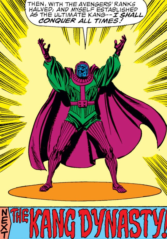 Kang raises his arms in the air and reveals his master plan.