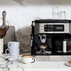 coffee machine on counter with pastries