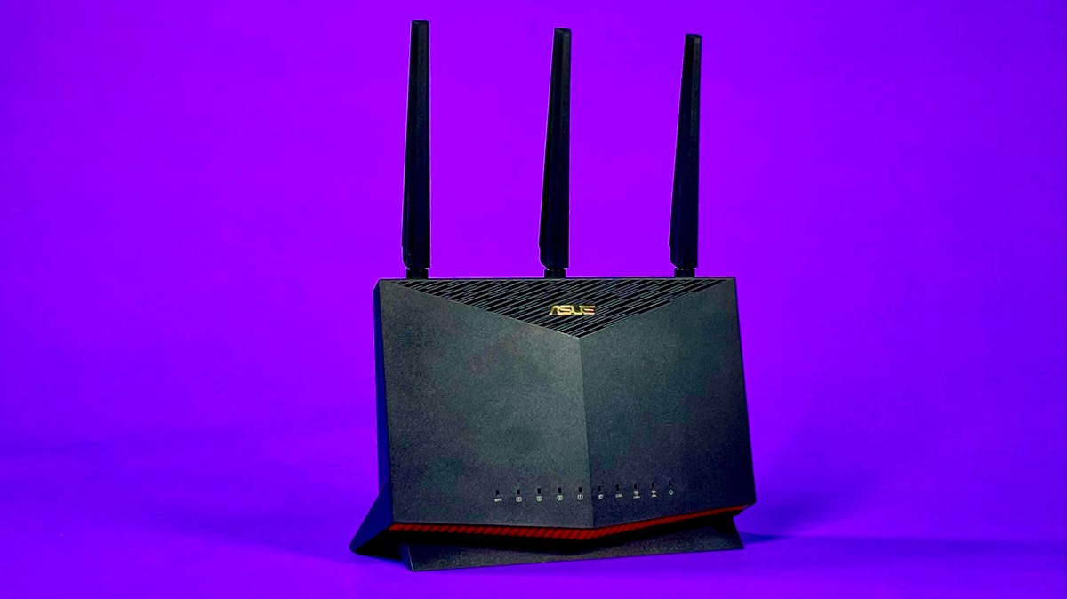 The Asus RT-AX86U Wi-Fi 6 gaming router against a purple background.