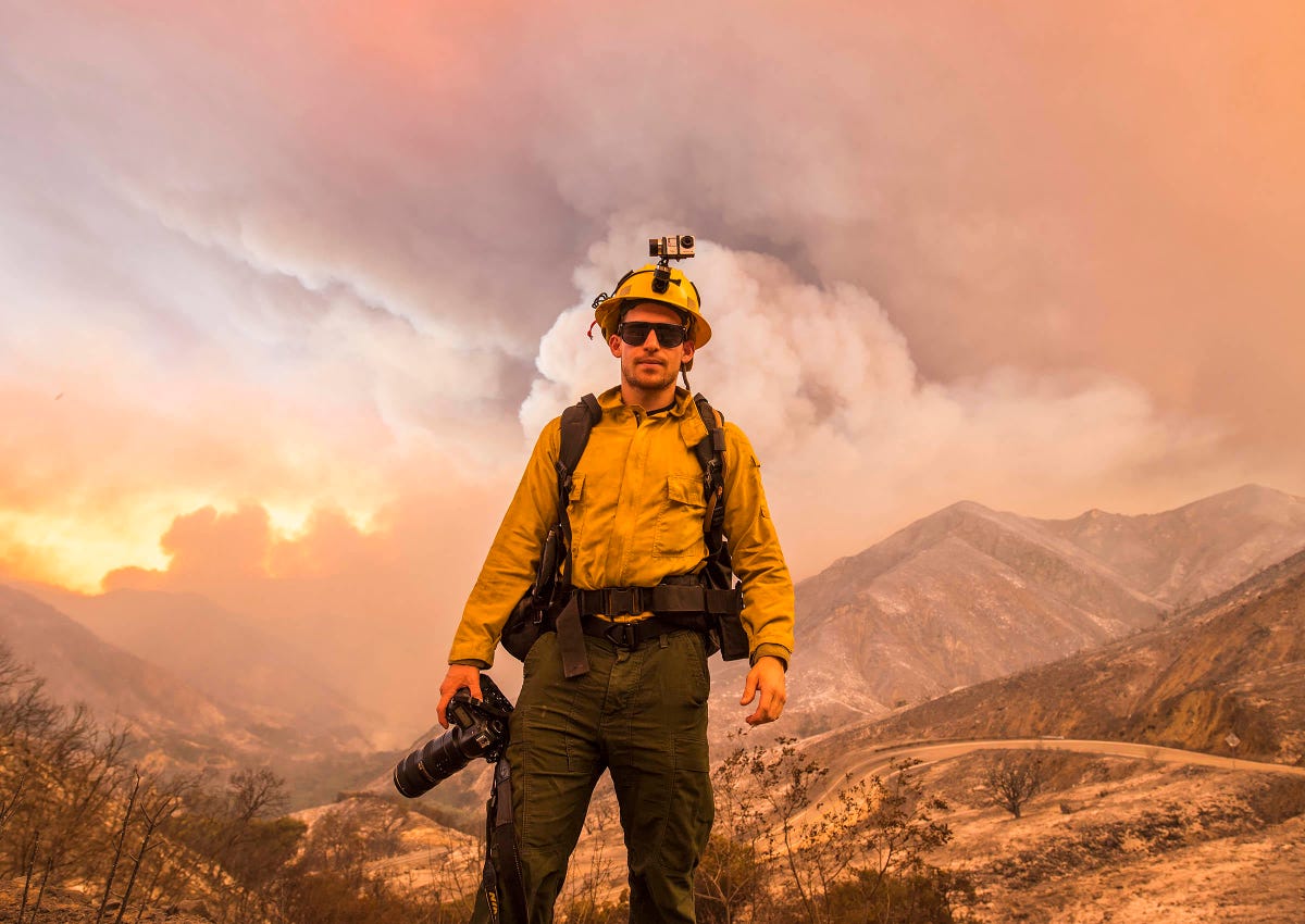 Stuart Palley, a professional wildfire photographer standing before the 2016 in the Angeles National Forest, believes mirrorless cameras will replace conventional SLRs.