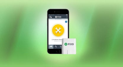 The FIXD Bluetooth OBD2 Scanner and its companion app on a phone are displayed against a green background.