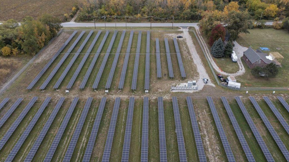 A solar farm on a rural property, seen from the air.