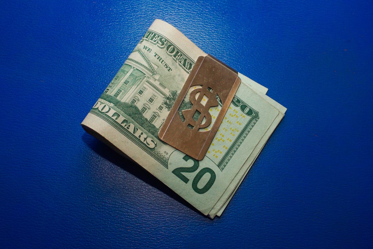 004-stimulus-piggy-bank-tear-falling-money-clip-weighing-cash-scale