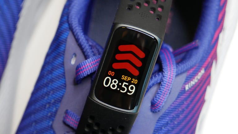 Fitbit charge 5 on shoe displaying September 20 at 8:59