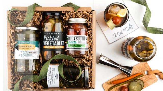 assortment of booze-infused pickle jars in box