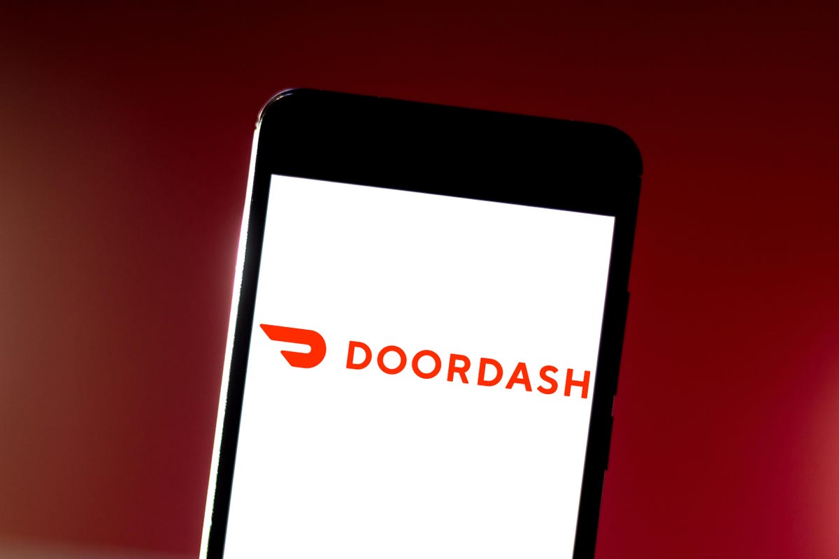 In this photo illustration the DoorDash logo is seen