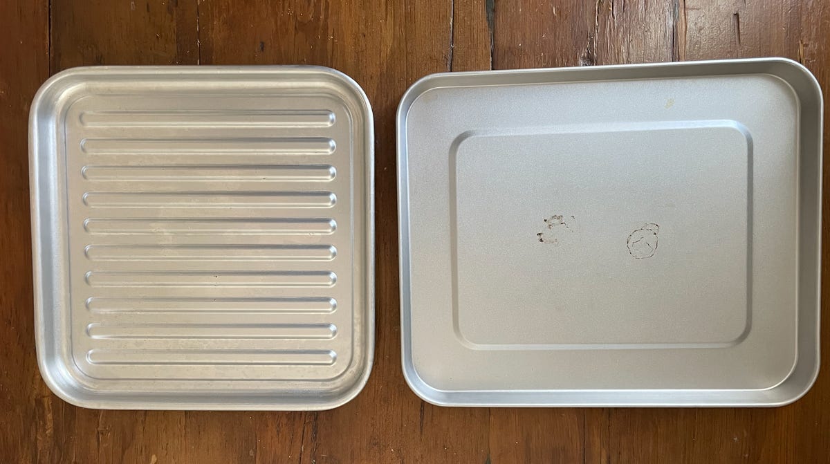 A side-by-side comparison of two toaster oven baking trays.