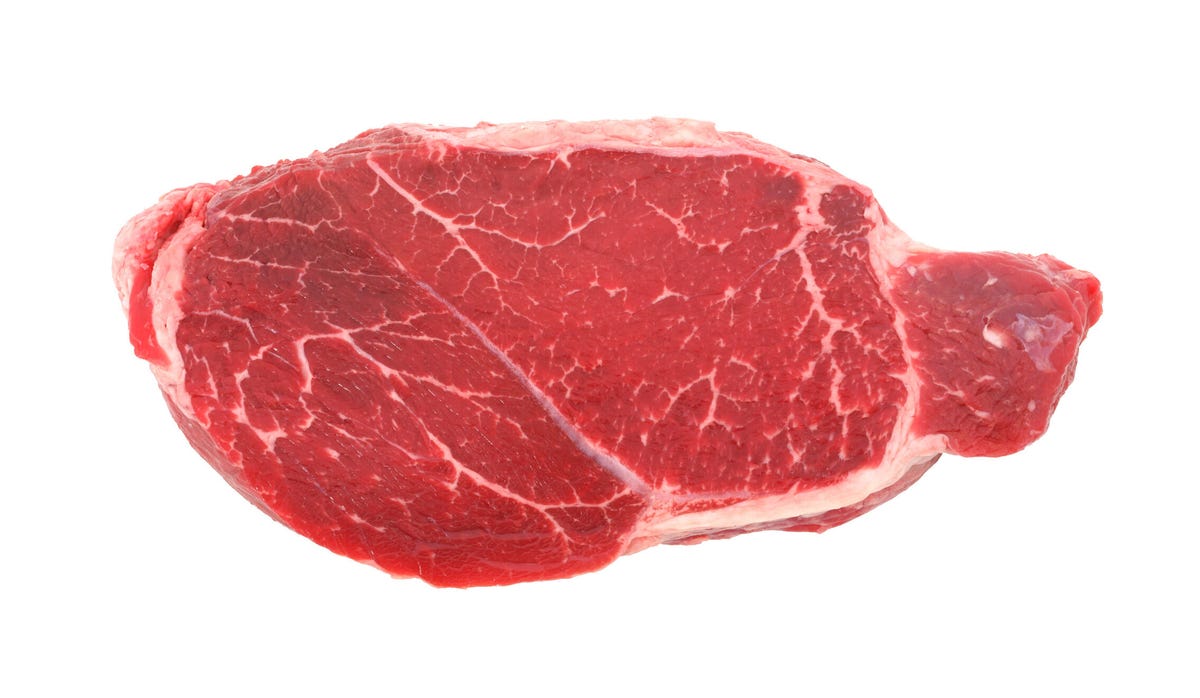 raw flank steak on white background