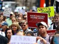 <p>CHICAGO, USA - AUGUST 27: A demonstrator holds a banner reading "Hate Has No Home Here" during a protest against racism and hate in Chicago, United States on August 27, 2017. People from different ethnicities and groups, gathered and marched from Federal Plaza Square to Trump Towers in order to defend and demand peace against the hate crimes and racist acts ending up in violent consequences.</p>