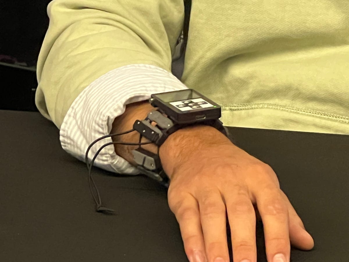Someone wearing a neural input wristband