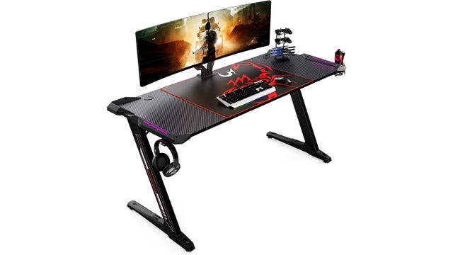 Carbon fiber topped desk with red gaming mat