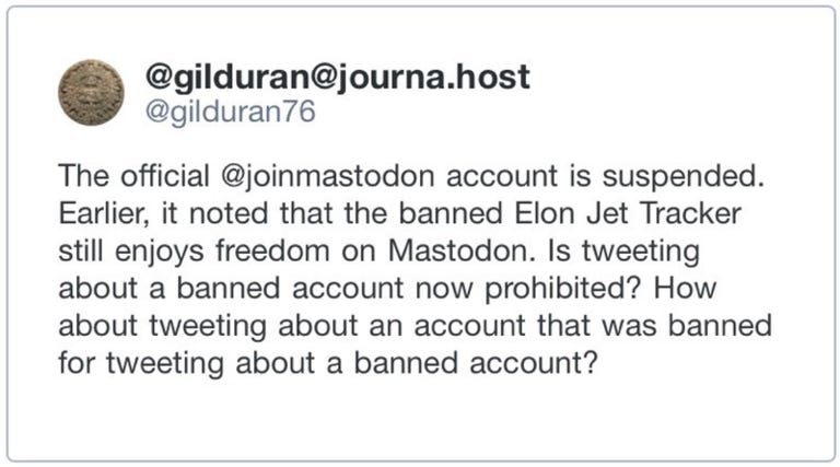 A tweet from San Francisco Chronicle reporter Gil Duran reading, The official @joinmastodon account is suspended. Earlier, it noted that the banned Elon Jet Tracker still enjoys freedom on Mastodon. Is tweeting about a banned account now prohibited? How about tweeting about an account that was banned for tweeting about a banned account?